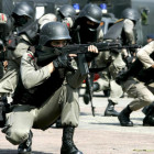 Indonesian anti-terror police unit show their skills during a security drill